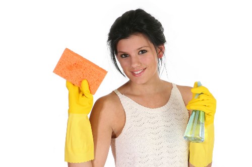 Professional oven cleaning service in a domestic kitchen